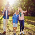 Take a look over there...Full length shot of a family of four walking in the woods. Royalty Free Stock Photo