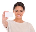 Take a look. Portrait of an attractive young woman holding a blank business card isolated on white. Royalty Free Stock Photo