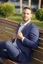 Take minute to refresh thoughts. Man in business suit relax sit bench in park. Businessman formal clothing boss or