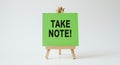 Take Note! Reminder on Easel - Important Information, Green Card, Note-Taking Tips, Study Aids & Creative Communication Visual Royalty Free Stock Photo
