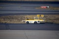 Take-off and landing runways with the vehicle to take the luggage on and off the planes at Johannesburg International Airport in
