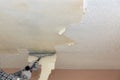 Take off in the popcorn ceiling home wall texture removal Royalty Free Stock Photo