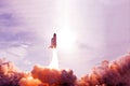 Take off space rocket on a background of blue sky and sun. Elements of this image were furnished by NASA Royalty Free Stock Photo