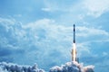 Take off space rocket on a background of blue sky and sun. Elements of this image were furnished by NASA Royalty Free Stock Photo