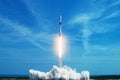 Take off space rocket on a background of blue sky and sun. Elements of this image were furnished by NASA Royalty Free Stock Photo
