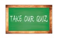 TAKE  OUR  QUIZ text written on green school board Royalty Free Stock Photo