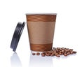 Take-out blank paper brown coffee cup with black cover, craft cup holder and beans Royalty Free Stock Photo