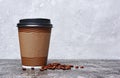 Take-out blank paper brown coffee cup with black cover, craft cup holder and beans Royalty Free Stock Photo