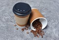 Take-out blank paper brown coffee cups with black covers, craft cup holders and beans Royalty Free Stock Photo