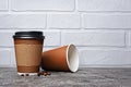 Take-out blank paper brown coffee cups with black covers, craft cup holders and beans Royalty Free Stock Photo