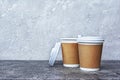 Take-out blank paper brown coffee cups with white covers and craft cup holders Royalty Free Stock Photo