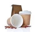Take-out blank paper coffee cups with cover, craft cup holders, beans and brown packet Royalty Free Stock Photo