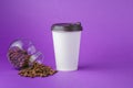 Take-out coffee in closed paper cup with beans Royalty Free Stock Photo