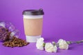 Take-out coffee in closed paper cup with beans Royalty Free Stock Photo