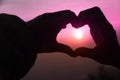 Take photo hands together to form a heart and light from sun in morning Royalty Free Stock Photo