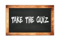 TAKE THE QUIZ text written on wooden frame school blackboard