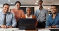 Take a seat, lets meet. a group of young businesspeople using a laptop at a conference in a modern office. Royalty Free Stock Photo