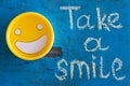 Take a smile. Motivational inscription.