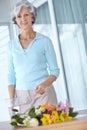 Take the time to do what you love. Portrait of a senior woman enjoying some flower arranging at home. Royalty Free Stock Photo