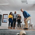 Take your chances in life and in business. Full length shot of a businessman playing golf in his office with his Royalty Free Stock Photo