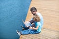 Take your e-Learning on summer holidays. Father and son use laptop. Engaging family in e-Learning Royalty Free Stock Photo