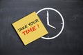 Take your time concept with alarm clock on school board Royalty Free Stock Photo