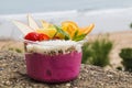 Takeaway acai bowl with fresh fruit and mint leaves Royalty Free Stock Photo