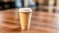 Takeaway coffee in brown paper cup with white plastic lid on a large smooth wooden table. Coffee to go. Blurred background. Royalty Free Stock Photo