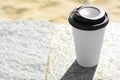 Takeaway coffee cup on stone surface outdoors. Space for text Royalty Free Stock Photo