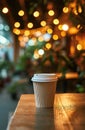 Takeaway coffee cup on a wooden table with warm ambient lighting