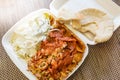 Take away food, Turkish or Greek gyros plate on take away box Royalty Free Stock Photo