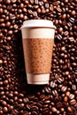 Takeaway paper cup of coffee with coffee beans