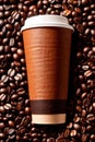 Takeaway paper cup of coffee with coffee beans