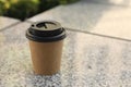 Takeaway paper cup with coffee on stone surface. Space for text Royalty Free Stock Photo