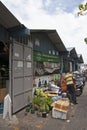 This is behind back of Vegetables & Fruits local market warehouse with motorbikes along Boduthakurufaanu Magu in Male. Maldives