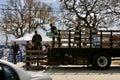 Air Force personnel unload supplies at outdoor relief center after Hurricane Katrina