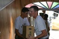 Air Force personnel carrying boxed water for Hurricane Katrina victims