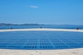 Blue sky mirrored within the `Greeting to the Sun` in Zadar, Croatia. Royalty Free Stock Photo