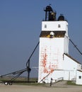 An old grain elevator on the prairies. Royalty Free Stock Photo