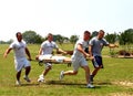 Air Force personnel enjoy stretcher carrying competition.