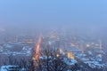 City lights in the fog at dawn