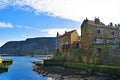 Inland view of Staithes harbour and Penny Nab, near Scarborough, in North Yorkshire.