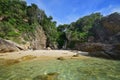 Stairs after walking down the steep cliff at Pulau Kapas Island, Marang, Terengganu, Malaysia with a view of water, rocky cliff Royalty Free Stock Photo