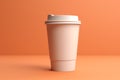 Takeout coffee cup on orange background.