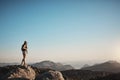 It takes courage to make it to the top. a young woman hiking up a mountain.