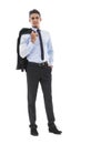 He takes everything in his stride. A handsome young man standing with blazer hanging over his shoulder against a white