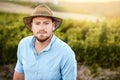 It takes hard work running this farm. Portrait of a farmer standing in a vineyard. Royalty Free Stock Photo