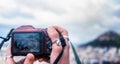 Female hands taking a photo of Athens with a digital camera Royalty Free Stock Photo