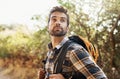 Taking in all the views as he walks. Cropped shot of a handsome young man hiking in the mountains. Royalty Free Stock Photo