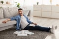 Cheerful male jew working on laptop at home taking break Royalty Free Stock Photo